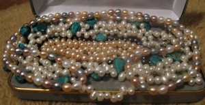 Momma's creamy pink, grey, white pearls withturquoise. No wonder Momma loves gems. I got to get me a pearl studded choker.