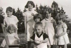 Buddy at the front, busy, busy Momma to the left holding chair, her brother behind her, her sister to her right. I know, Buddy looks as tall as Buddy here but it is an optical illusion.