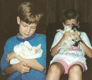 Our JAG boy lovingly holds FInicky. Beside him Wonder Boy holds Finicky and Fraidy Cat (he was so teeny tiny, even his tail was short).