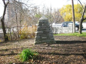 Street view and corner lot that sees a lot of action with back side of monument showing.